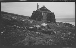 Image of Stone hut, sign over door: Moskus Heimen Exp.1928-30